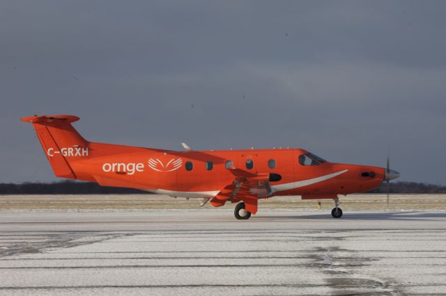 Pilatus PC-12 (C-GRXH) - Pilatus Air Ambulance taxis out on Taxiway Alpha for Runway 25 departure from Kingston