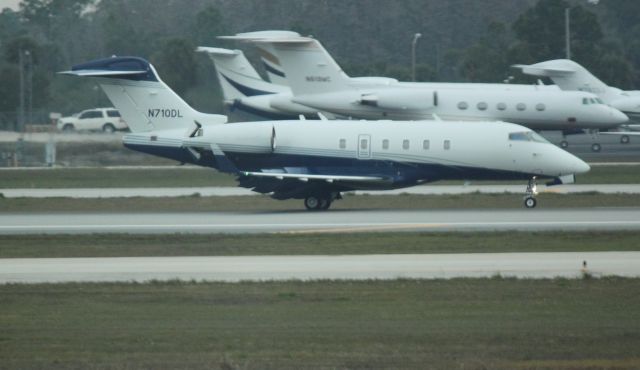 Bombardier Challenger 300 (N710DL) - Landing at RSW on 02/11/2011