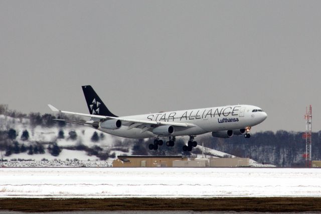 Airbus A340-300 (D-AIGP) - Lufthansa A340-300 in Star Alliance livery arriving to a snowy Logan Airport on 2/20/21. This aircraft also diverted to Logan from JFK due to weather on 2/18/21. 