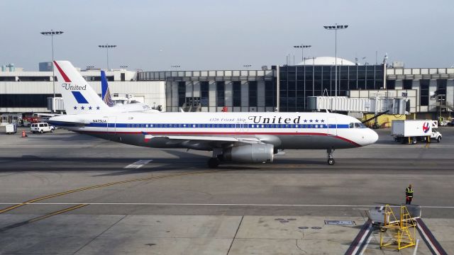 N475UA — - Tug disconnected, taxiing out of the gate area for departure, taken from the Alaska Airlines Lounge Terminal 6 on December 21, 2014