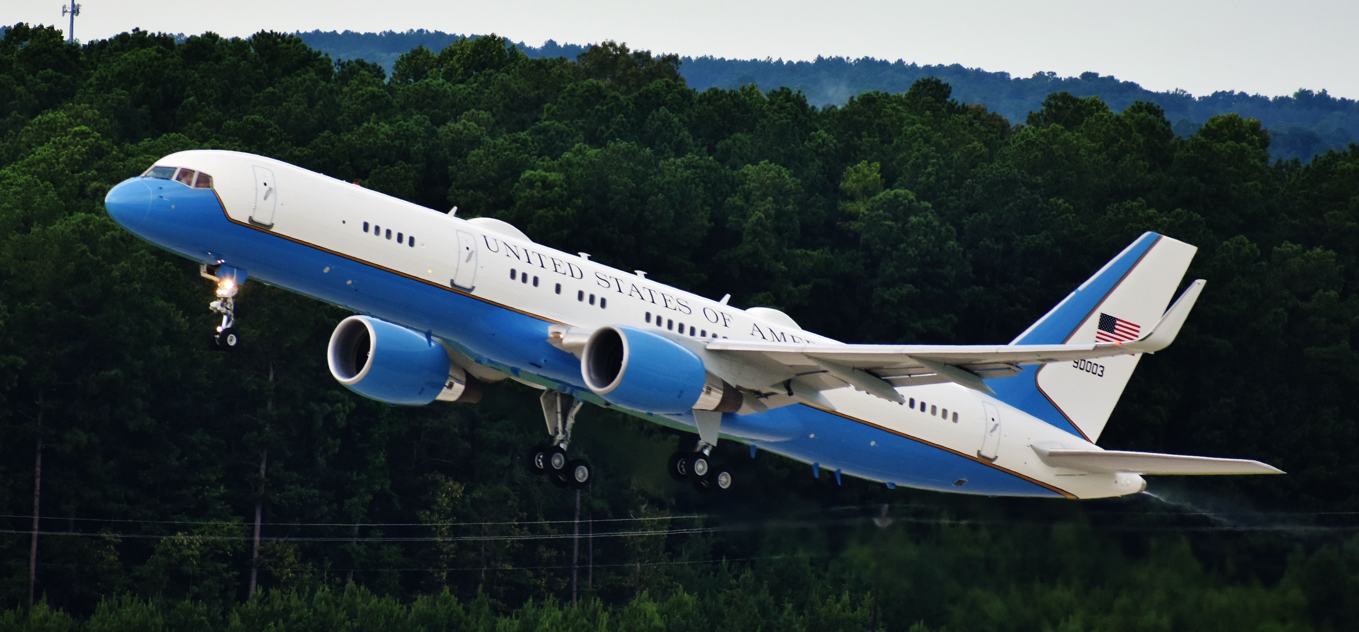 Boeing 757-200 (99-0003) - In an almost one-two punch, fairly unprecedented for RDU, we had AF1 in on Monday - and AF2 on Wednesday! VP Pence visited town to both a school and the Fujifilm laboratory President Trump visited Monday.  Note the rain spray - we had quite the thunderstorm over the field.  From the RDU parking deck, 7/29/20.