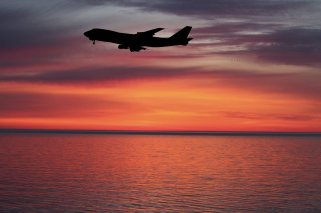 Boeing 747-200 (N704CK) - Aircraft approaching for landing over Lake Huron early in the morning before a beautiful sunrise.