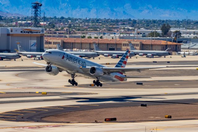 Boeing 777-200 (N784AN) - American Airlines 777-200 taking off from PHX on 10/9/22. Taken with a Canon 850D and Rokinon 135mm f/2 manual focus lens.