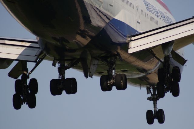 Boeing 747-200 — - Seconds before the wheels will absorb the massive weight of the Queen