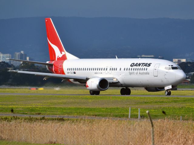 BOEING 737-400 (VH-TJS) - On taxi-way heading for take off on runway 05. Thursday 12th July 2012.