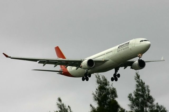 Airbus A330-300 (VH-QPC) - Brushing the tops of the trees prior to landing on r/w 07