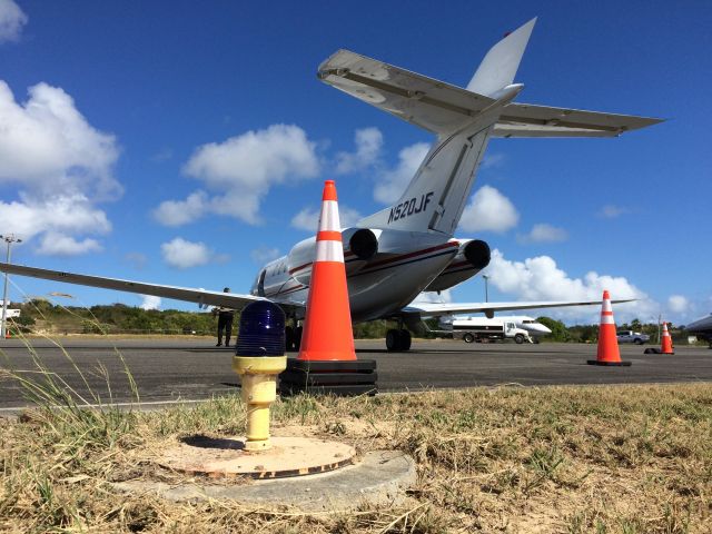 Hawker 800 (N520JF) - Preflighting in Anguilla on a beautiful day.