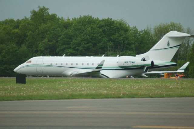 Bombardier Global 5000 (N375WB) - Global N375WB on taxiway Alpha, notice the field elevation hides the landing gear.