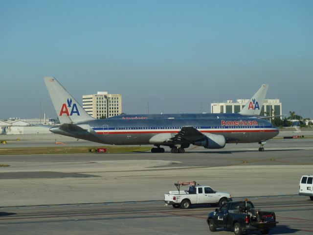 BOEING 767-300 (N372AA) - B763 taxiing; B772 lined up.