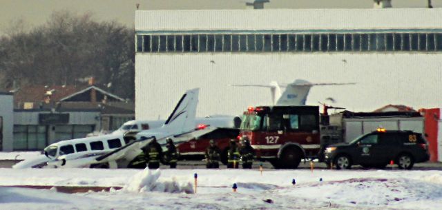 Piper Navajo (N727SC) - Piper N727SC on 4R at Chicago Midway after landing gear collapse.