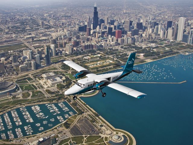 De Havilland Canada Twin Otter (N82LH) - Sky Team Aviations flagship Twin Otter over the Chicago skyline.  This aircraft is based at Chicagoland Skydiving Center in Hinckley, IL.