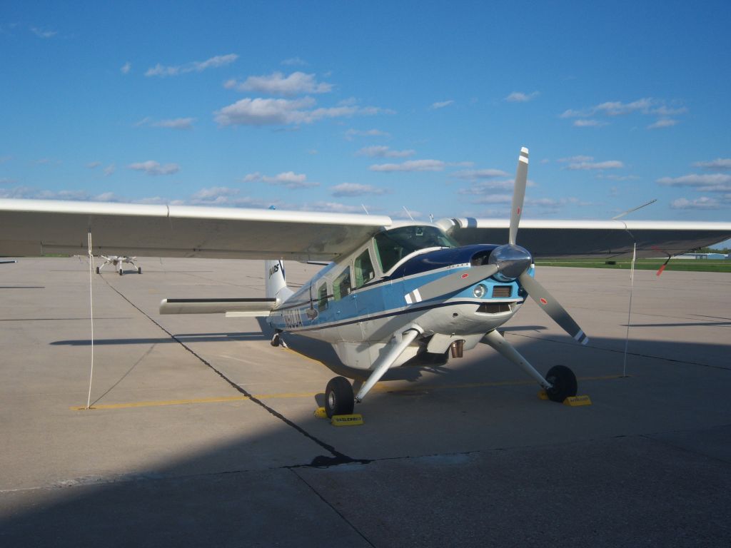 HELIO U-10 Super Courier (N60JA) - JAARS Helio on the ramp at KOSH, note the cargo pod underneath. Lycoming GO-480-G1D6 (295 HP)