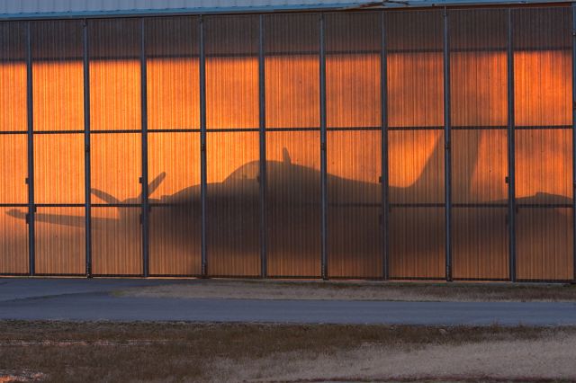 Beechcraft Baron (58) (N269RA) - You can clearly see the outline of a Baron in this photo.  The sun was setting through the hangar door and it made a great filter.