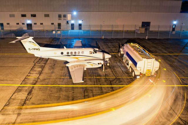 Beechcraft Super King Air 200 (BXH151) - Rooftop at Integra Air. Long Exposure as a fuel truck arrives to service this Air Ambulance.