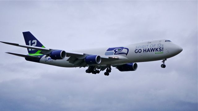 BOEING 747-8 (N770BA) - Painted to honor the Seattle Seahawks football team and their fans, BOE12 on final to Rwy 16R on 1/30/14. (LN:1437 cn 37564).