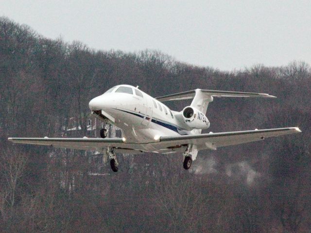 Embraer Phenom 100 (N784JP) - Take off runway 08. CFM (Corporate Flight Management) has 3 x King Air 100, 1 x Phenom 100 and 2 x Citation V available for charter in the New York metropolitan area KDXR KHPN KTEB KBDR  a rel=nofollow href=http://WWW.FLYCFM.COMWWW.FLYCFM.COM/a