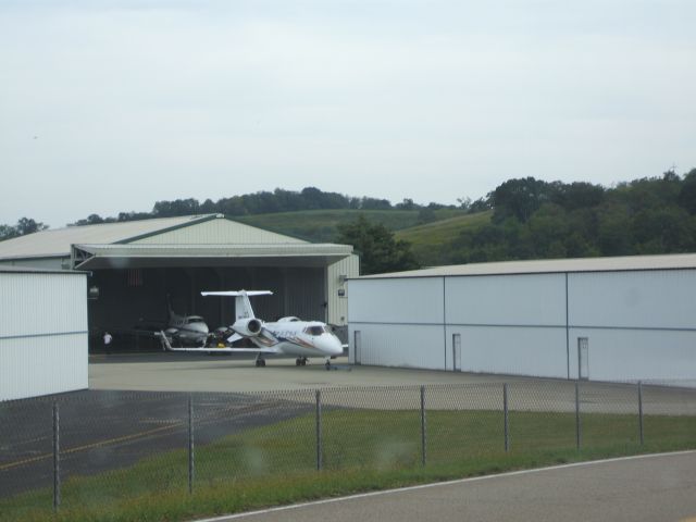 Learjet 60 (N156DH) - Learjet 60 sitting outside its hangar at Washington County.