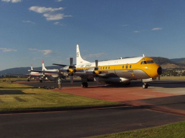 Lockheed L-188 Electra (C-GZVM) - Electra and two Convair at Penticton Regional Airport, Forest Services tanker base.