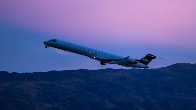 Canadair Regional Jet CRJ-900 (N248LR) - Mesa Airlines CRJ-900 taking off from PHX on 8/20/22. Taken with a Canon 850D and Rokinon 135mm f/2 manual focus lens.