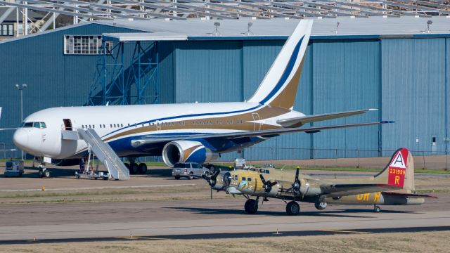 Boeing B-17 Flying Fortress (N93012) - N93012 "Nine-O-Nine" B-17G-85-DL 44-83575, with Boeing 767 N767KS in the background at Dallas Love Field on March 17, 2019.