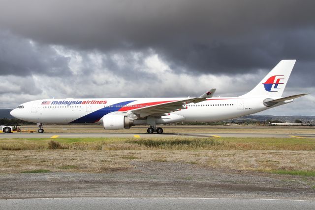 Airbus A330-300 (9M-MTL) - Under tow from Bay 80 to Bay 18 after its layover in Adelaide.