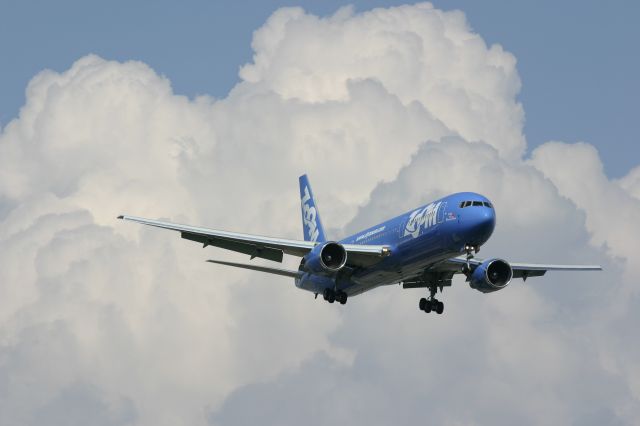 BOEING 767-300 (C-GZNC) - July 28, 2006 - Zoom Airlines 767 glided behind huge clouds in Toronto 