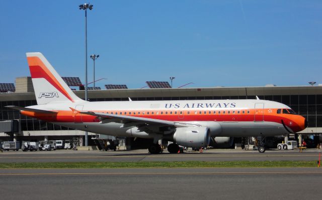 Airbus A319 (N742PS) - Smiley !  PSA paint @ KBOS Logan.....