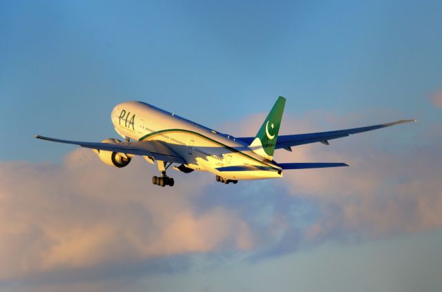 Boeing 777-200 (AP-BGY) - Evening departure with beautiful golden lights.