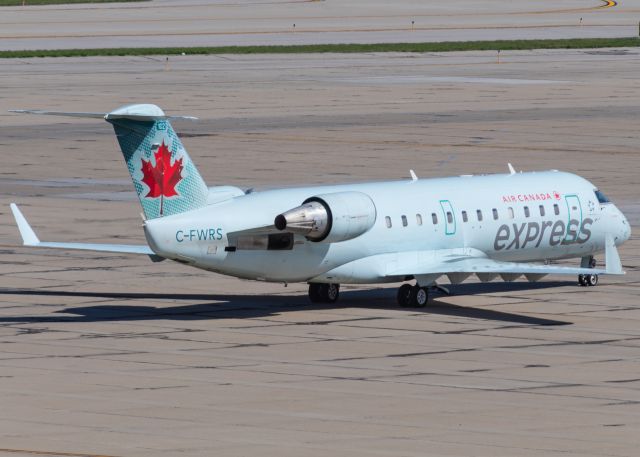 Canadair Regional Jet CRJ-100 (C-FWRS) - Air Canada Express pushes back from its gate at CVG.