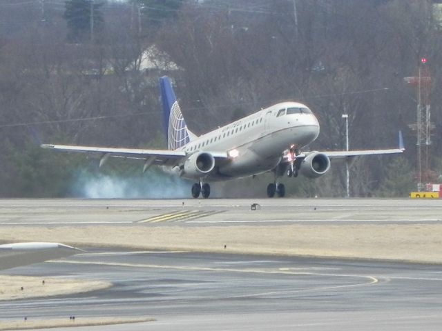 Embraer 170/175 (N651RW) - tire smoke on landing 20-R KBNA 1-10-14