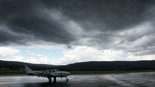 Beechcraft Baron (58) (N2348Q) - Stormy weather at Whiteriver, AZ.