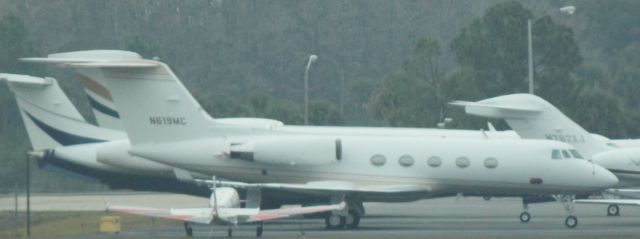 Gulfstream American Gulfstream 2 (N619MC) - Sitting in the rain at RSW on 2/11/2011 with the rest of the crowd