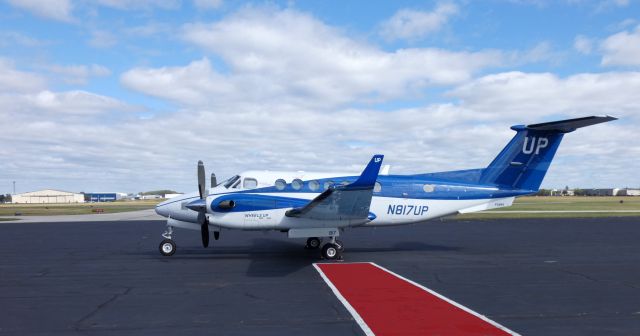 Beechcraft Super King Air 350 (N817UP) - Parked in front of the terminal is this 2013 Beechcraft Super King Air 350 in the Autumn of 2019. Who's UP for a Flight?