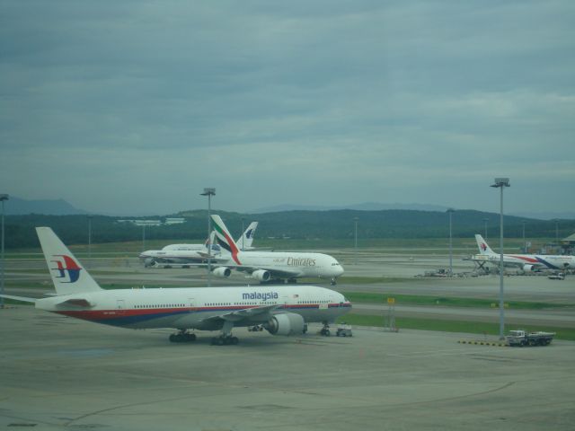 Boeing 777-200 (9M-MRM) - TAKEN FROM THE KLIA VIEWING GALLERY. A380 IN THE BACKGROUND.