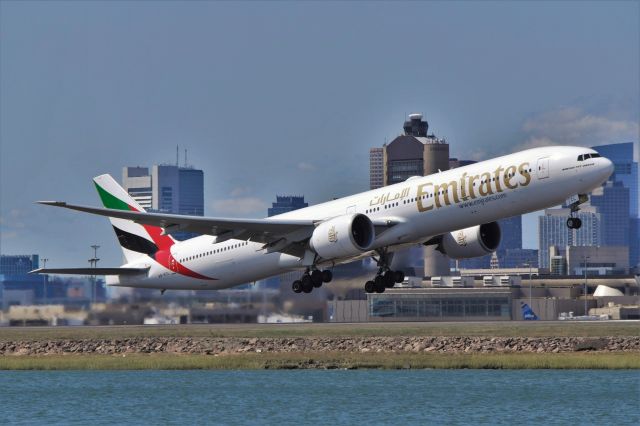 BOEING 777-300 (A6-ECL) - Emirates 777-300ER (EK240) departing off of 4R this morning.