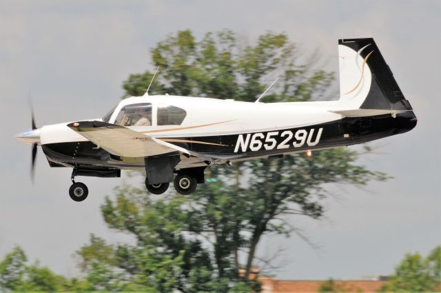 Mooney M-20 (N6529U) - Nice 1962 build Mooney M20C arriving runway 18 at Greenwood Indiana.