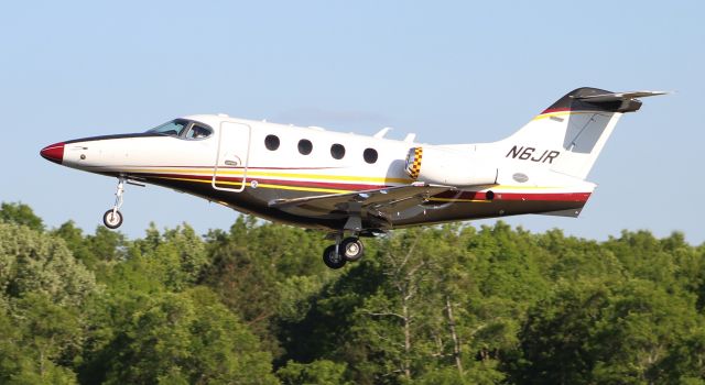 Beechcraft Premier 1 (N6JR) - Roush Fenway Racing's 2011 model Hawker Beechcraft 390 Premiere 1A departing Boswell Field, Talladega Municipal Airport, AL, following NASCAR's GEICO 500 race at Talladega Super Speedway - late afternoon, April 25, 2021. 