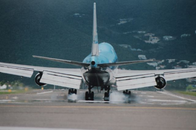 Boeing 747-200 — - Just passed over my head on Maho Beach in St. Maarten! Sorry for quality, digital photo of old print.