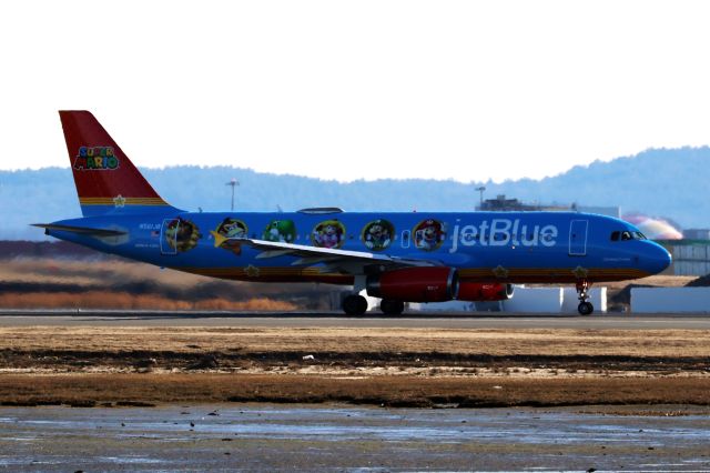 Airbus A320 (N561JB) - Jet Blue A320 in new Super Mario special livery departing BOS on 3/10/25.