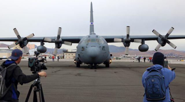 Lockheed C-130 Hercules (93-7311) - With both outboards already shut down and windmilling down to a stop and both inboards at Idle, the Nevada Air Guards 93-7311, a C-130H, holds position very briefly to provide a head-on shot for two local television station cameramen and me before turning to its parking spot on Reno Tahoe Internationals west ramp.