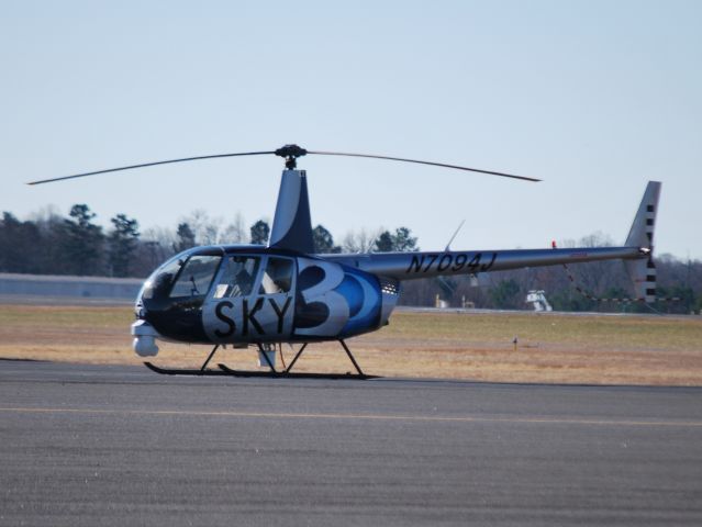 Robinson R-44 (N7094J) - METRO NETWORKS COMMUNICATIONS INC, CBS affiliate WBTV "SKY 3" parked at Wilson Air Center - 12/10/14 