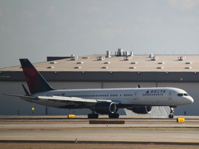 Boeing 757-200 (N662DN) - Smoke from nose wheel touching down on 27L while landing at ATL on 02/25/2011