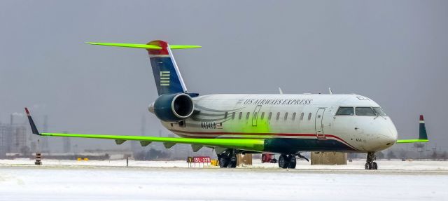 Canadair Regional Jet CRJ-200 (N454AW) - Wearing a beautiful winter jacket that not too many people have seen.