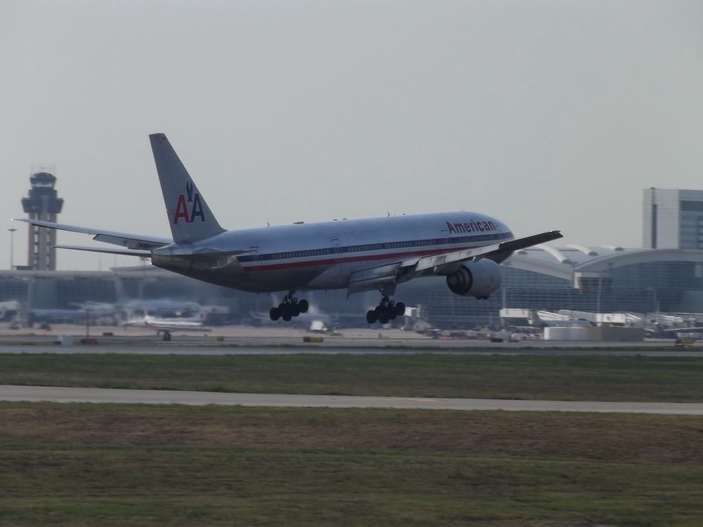 Boeing 777-200 — - Took this picture at founders plaza off Runway 18R.