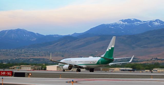 Boeing 737-800 (N916NN) - The sky was getting lighter but the sun had not yet popped up over the crest of the Virginia Range Mountains east of Reno Tahoe International as American's N916NN, which wears the Reno Air heritage paint scheme, raced down runway 16L at 6:02 AM to become the first commercial passenger flight to depart this morning. The paxbird was headed to Dallas (KDFW).