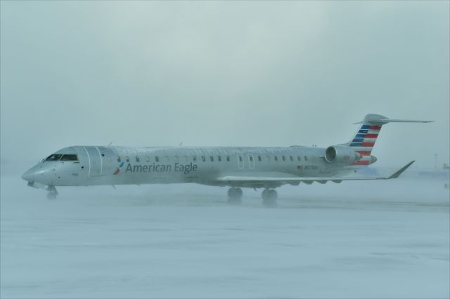 Canadair Regional Jet CRJ-900 (N571NN) - Waiting for a deice in a snow storm.   Best in full