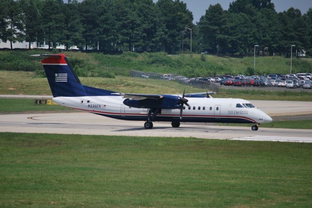 de Havilland Dash 8-300 (N336EN) - Rolling down runway 18C - 6/28/09