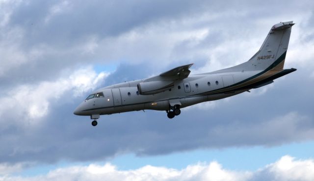 Fairchild Dornier 328JET (N429FJ) - On final is this 2001 Fairchild Dornier 328-300 Twin-Jet in the Autumn of 2018.  Aircraft could carry up to 34 Passengers. 