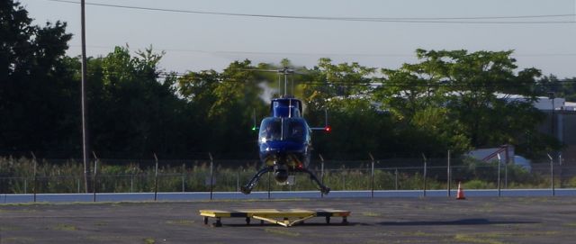 Bell JetRanger (N11TV) - LINDEN, NEW JERSEY, USA-SEPTEMBER 03, 2019: A helicopter belonging to one of the local New York City television news stations is seen moments before landing at Linden Airport.