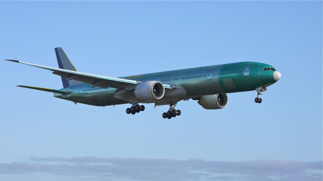 BOEING 777-300 (HZ-AK12) - BOE227 on final to runway 16R to complete its maiden flight on 12/21/11.